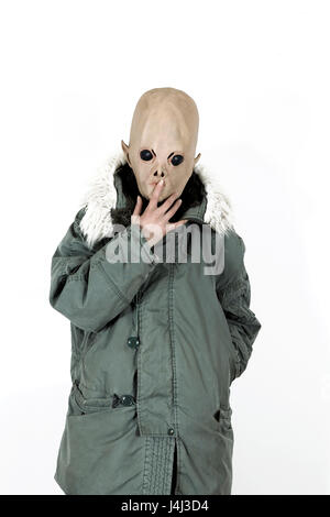 Alien wearing a military coat with hood fake fur Stock Photo