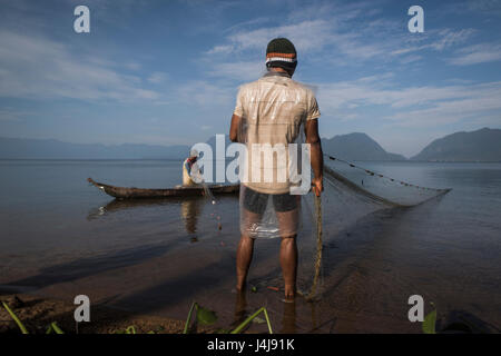 Fishermen at work in the Lake Maninjau, Sumatra, Indonesia. Stock Photo