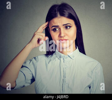 Worried pensive young woman thinking Stock Photo