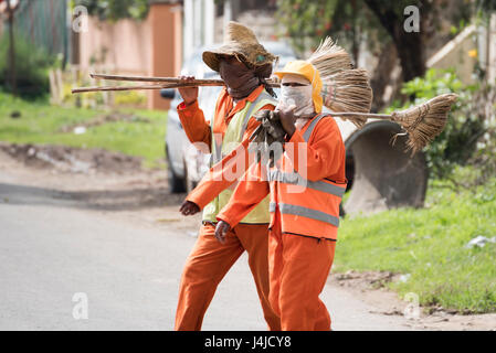 Ethiopian Street Cleaner in uniform walking on road in Addis Ababa Stock Photo