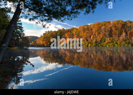 Beautiful autumn morning with reflecting lake and trees Stock Photo