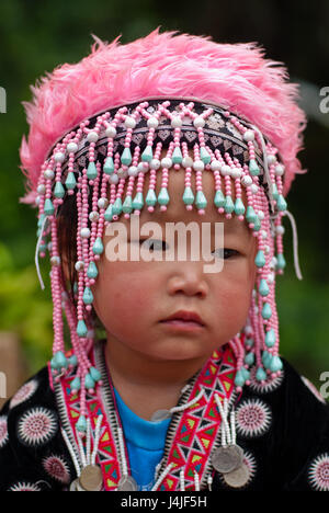 CHIANG MAI, THAILAND - OCTOBER 25 : Portrait of unidentified Akha hill tribe children with traditional at Wat Phratat Doi Suthep on OCTOBER 25, 2009 i Stock Photo