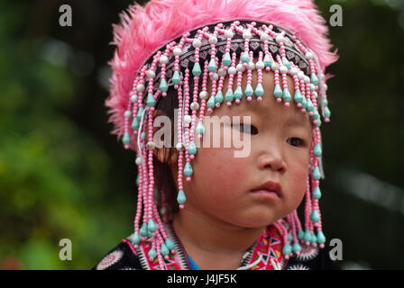 CHIANG MAI, THAILAND - OCTOBER 25 : Portrait of unidentified Akha hill tribe children with traditional at Wat Phratat Doi Suthep on OCTOBER 25, 2009 i Stock Photo