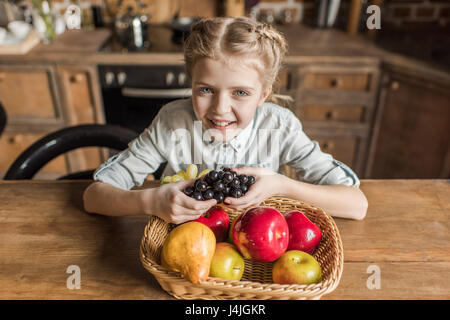 Family concept. Mother, father and small pretty girl at home Stock Photo