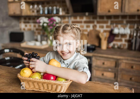 Family concept. Mother, father and small pretty girl at home Stock Photo