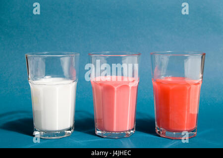 set of gradient cocktail in beer glasses on a blue background Stock Photo