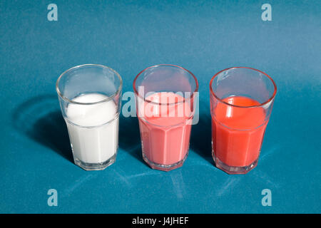 set of gradient cocktail in beer glasses on a blue background Stock Photo