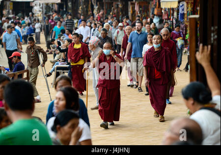 NEPAL Kathmandu, Boudhanath Stupa is the largest stupa in Nepal and the holiest Tibetan Buddhist temple outside Tibet. It is the center of Tibetan culture in Nepal, Monks circle around the stupa Stock Photo