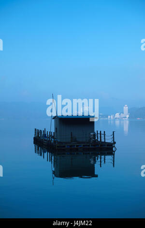 Taiwanese fishing boat on Sun Moon Lake in the early morning Stock Photo