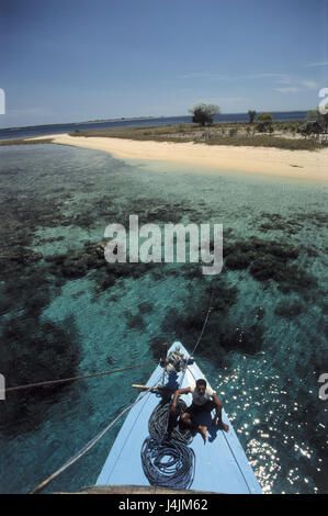 Indonesia, island Sumbawa, beach, sea, sailboats, man, sit, from above, no model release! Asia, South-East Asia, Bahasa Indonesia, Malay archipelago, small Sundainseln, tropics, tropical island, Indian ocean, corals, water, clearly, sandy beach, coast, boat, swarthy Stock Photo