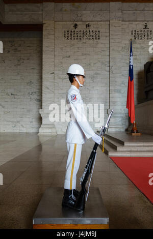 Soldier of The Honor Guard of ROC in white uniform at the Chiang Kai-Shek Memorial Hall in Taipei Stock Photo