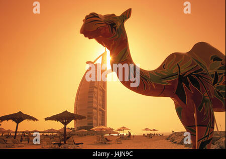United Arab Emirates, Dubai, five-star hotel Burj Al Arab, palms, beach, camel, sundown front East, the Near East, the Middle East, Arabian peninsula, Arabia, VAE, United Arab of emirate, UAE, emirate, sheikdom, capital, building, hotel, Burj-al-Arab, 7-star hotel, structure, landmark, imposingly, modern, architecture, builds in 1999, architects W.S. Atkins & partner, height 321 m, completion in 1999, high rise, hotel business, tourism, wealth, luxury, vacation, place of interest, afterglow, beach lying, sunshades, Jumeira Beach, sculpture, camel sculpture
