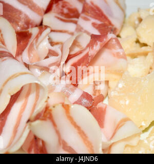 dish with thin slices of parma ham and roast pork cured meat Stock Photo