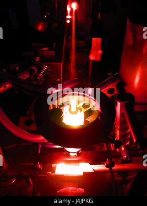 Laser research. Red laser beam being produced by a laser in a research laboratory. The acronym LASER stands for 'light amplification by stimulated emission of radiation'. The laser was developed in 1960 and laser technology is now used in many different a Stock Photo
