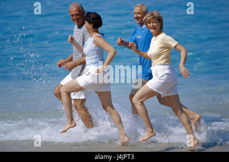 Couples, middle old person, beach run outside, summer, vacation, leisure time, lifestyle, four, friends, together, fun, happily, tuning, positively, sport, sportily, beach, sea, run, jog, jogging, fit fitness, agile, motion, activity, leisurewear Stock Photo