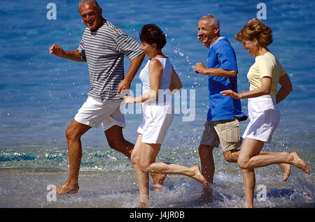 Couples, middle old person, beach run outside, summer, vacation, leisure time, lifestyle, four, friends, together, fun, happily, tuning, positively, sport, sportily, beach, sea, run, jog, jogging, fit fitness, agile, motion, activity, leisurewear Stock Photo