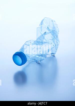 Crushed plastic bottle, studio shot. Stock Photo