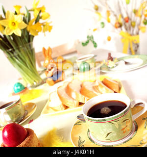 Easter, breakfast table, decorates Easter feast, breakfast, table, covered, Easter decoration, österlich, coffee cup, Easter eggs, Easter bunny, daffodils, narcissi, bouquet, traditions, festively, still life Stock Photo