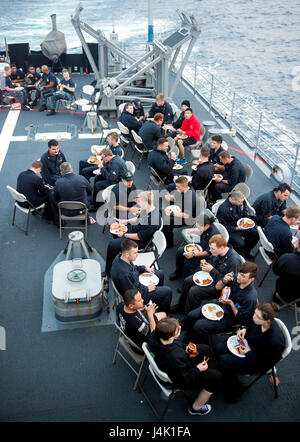 161112-N-FT178-069  PACIFIC OCEAN (Nov. 12, 2016) Sailors eat on the fantail of the Ticonderoga-class guided-missile cruiser USS Lake Champlain (CG 57) during a steel beach picnic. Lake Champlain is underway with Carrier Strike Group One conducting Composite Training Unit Exercise in preparation for a future deployment. (U.S. Navy photo by Petty Officer 2nd Class Nathan K. Serpico/Released)