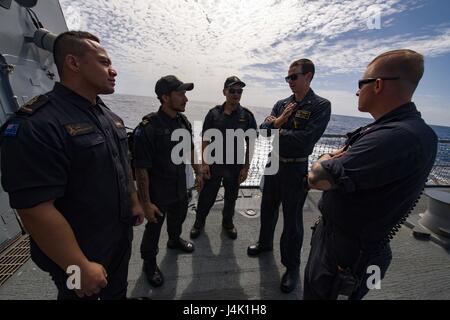 161113-N-DJ750-163 PACIFIC OCEAN (Nov. 13, 2016) – Sailors aboard Arleigh Burke-class guided-missile destroyer USS Sampson (DDG 102) give Royal New Zealand Navy sailors a tour of the flight deck. Sampson will report to U.S. Third Fleet, headquartered in San Diego, while deployed to the Western Pacific as part of the U.S. Pacific Fleet-led initiative to extend the command and control functions of Third Fleet into the region. (U.S. Navy photo by Petty Officer 2nd Class Bryan Jackson/Released) Stock Photo