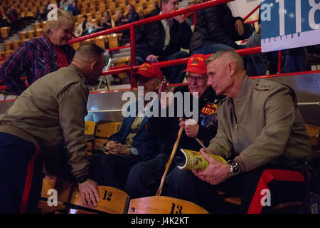 Sgt. Maj. Patrick L. Kimble (left), sergeant major of Marine Forces Reserve and Marine Forces North, and Lt. Gen. Rex C. McMillian (right), commander of MARFORRES and MARFORNORTH, talk with World War II veterans who fought in the Battle of Iwo Jima at the National Western Stock Show in Denver, Jan. 17, 2017. Leaders of MARFORRES were in attendance to commemorate veterans and the 100th anniversary of the Marine Corps Reserve. From World War I through the wars in Iraq and Afghanistan, the Marine Corps Reserve has played an essential role in the Marine Corps Total Force by augmenting and reinforc Stock Photo
