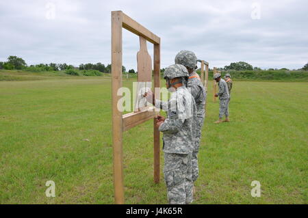 In this image released by the Army Reserve's 75th Training Command, Soldiers with the unit's Headquarters Detachment train at a military rifle range in Bastrop, Texas, Saturday, April 22, 2017. High individual readiness in the reserves in areas like marksmanship helps deter threats abroad. (Photo/75th Training Command, Army Reserve Lt. Col. Adam Collett) Stock Photo