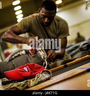 Parachute Riggers wear the Red Hat signifying that they are experts ...