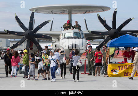 Japanese locals view various U.S. and Japanese static display aircraft during the 41st Japan Maritime Self-Defense Force – Marine Corps Air Station Iwakuni Friendship Day at MCAS Iwakuni, Japan, May 5, 2017. Displays included of F/A-18C and F/A-18D Hornets, an MV-22B Osprey and F-35B Lightning II from the III Marine Expeditionary Force, F-16 Fighting Falcon, A-10 Thunderbolt II, and KC-135 Stratotanker from U.S. forces in Korea. Displays also encompassed a C-1, MC-130J, A6M Zero, and MCH-101 from the Japan Air Self-Defense Force and JMSDF, along with WACO biplanes and Cessna airplanes from the Stock Photo