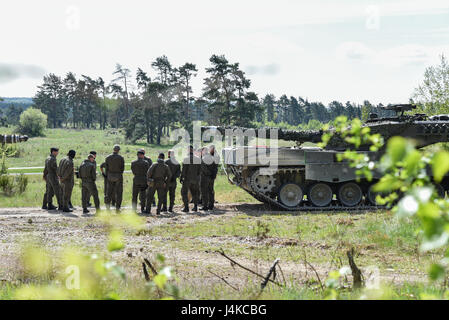 Austrian soldiers with the Bundesheer platoon, get briefed before conducting the vehicle identification lane, during the Strong Europe Tank Challenge (SETC), at the 7th Army Training Command Grafenwoehr Training Area, Grafenwoehr, Germany, May 10, 2017. The Strong Europe Tank Challenge (SETC) is co-hosted by U.S. Army Europe and the German Army, May 7-12, 2017. The competition is designed to project a dynamic presence, foster military partnership, promote interoperability, and provides an environment for sharing tactics, techniques and procedures. Platoons from six NATO and partner nations are Stock Photo