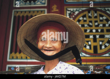 Vietnam, Hoi In, senior, straw hat, portrait South-East Asia, woman, old, 83 years, 80-90 years, care, headgear, view camera, laugh, joy, expression, mood positively Stock Photo