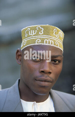 The Comoro Archipelago, island Anjouan, Mutsamudu, man, young, cap, portrait no model release! Africa, Indian ocean, island state, Nzwani, man's portrait, young, non-white, swarthy, swarthy, local, headgear, traditionally, tradition, faith, religion, religiously, Moslem, Islamic, Islam, view camera Stock Photo