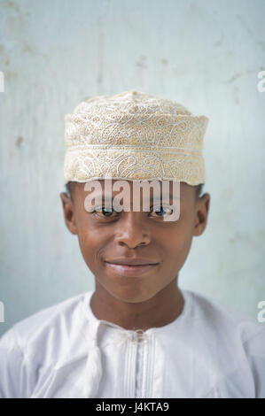 The Comoro Archipelago, island Anjouan, Mutsamudu, boy, cap, portrait no model release! Africa, Indian ocean, island state, Nzwani, child, non-white, swarthy, swarthy, local, clothes, headgear, white, traditionally, tradition, faith, religion, religiously, Moslem, Islamic, view camera, smile Stock Photo