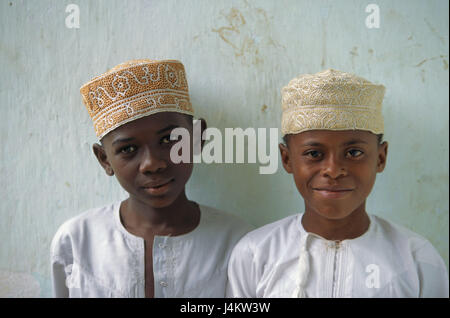 The Comoro Archipelago, island Anjouan, Mutsamudu, boy, caps, portrait no model release! Africa, Indian ocean, island state, Nzwani, children, two, non-whites, swarthy, swarthy, locals, clothes, headgear, white, traditionally, tradition, faith, religion, religiously, Moslem, Islamic, view camera, smile Stock Photo