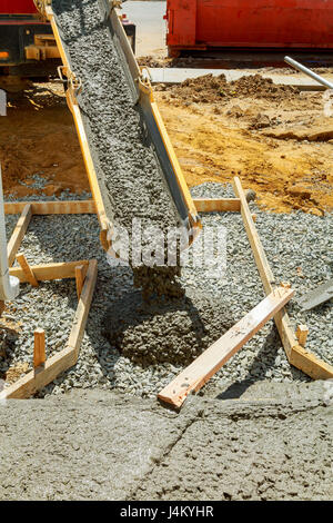 Concrete pouring during commercial concreting floors of buildings in construction Stock Photo