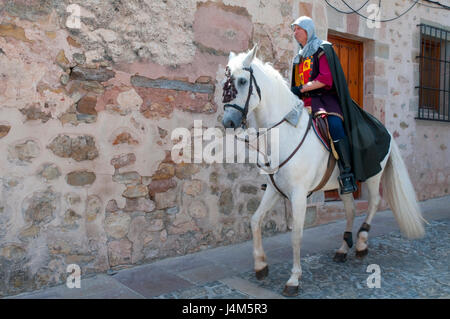 Man wearing medieval clothes and riding a horse. Medieval Days, Sigüenza, Guadalajara province, Castilla La Mancha, Spain. Stock Photo