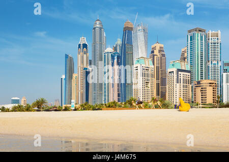 DUBAI, UAE - MARCH 28, 2017: The Marina towers from beach. Stock Photo