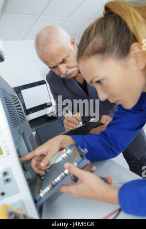 Technician working on electrical appliance Stock Photo