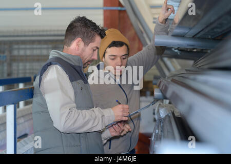 men working in newspaper factory Stock Photo