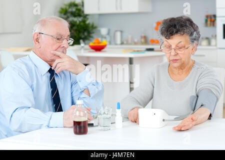 senior couple sorting their medications for the week Stock Photo