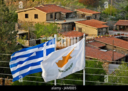 Greek and Cypriot flag, side by side at Fikardou village, one of the most beautiful mountainous villages of Cyprus, Nicosia (Lefkosia) district. Stock Photo