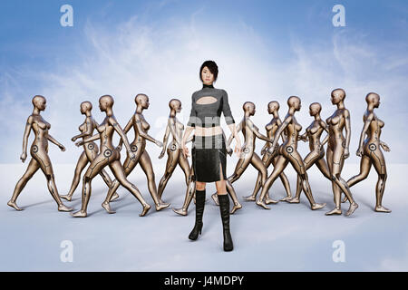 Portrait of woman standing in front of walking robots Stock Photo