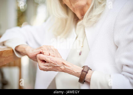 Hands of older Caucasian woman Stock Photo