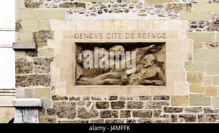 Geneva, Switzerland. April 13, 2016. statue and inscription that says 'Geneva, city of refuge' in the tower Molard in the Rue du rhone Stock Photo