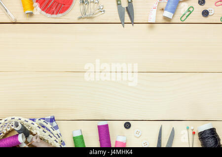 Top view tailor items on wooden background with copy space. Stock Photo