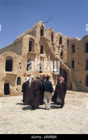 Tunisia, region of Tataouine, Ksar Ouled Soultane, memory castles, bedouins, no model release! Africa, Südtunesien, oasis, building, fortress, castle, Ksar, niches, memories, Ghorfas, granaries, old, architecture, outside, village, structure, tradition, culture, story, destination, place of interest, travelling, people, men Stock Photo