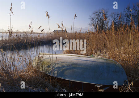 Germany, Upper Bavaria, Chiemgau, Lake Chiem, reed, oar boot, morning tuning, autumn Europe, Bavaria, foothills of the Alps, Lake Chiem, lake, lakeside, grass, boat, fishing boat, hoarfrost, maturity, cold, rest, silence, Idyll, loneliness, deserted, autumnally Stock Photo