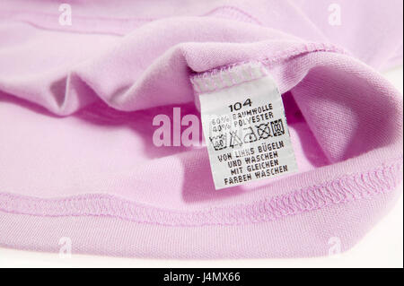 Garment, label, nursing instructions clothes, clothing, textiles, upper top, pullover, pink, clothing, child clothes, child clothing, nursing label, size, standard size, information, tip, instructions, care, cleaning, washing, icons, laundry symbols, entries, materials, material mix, nursing icons, washing instructions, instruction, close up Stock Photo
