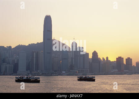 China, Hong Kong, Hong Kong Iceland, skyline, Victoria Harbour, ferries, sea, evening light, Asia, town, city, cosmopolitan city, metropolis, town view, skyscraper, high rises, architecture, harbour, navigation, ferryboat, ships, ship traffic, Star-Ferry, means of transportation, personal transport, mountain, dusk, dusk, haze, atmospheric, copy space, Stock Photo