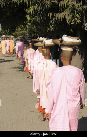 Monks, female, young, Buddhists, line-up, food output, Pyay, Myanmar, Stock Photo