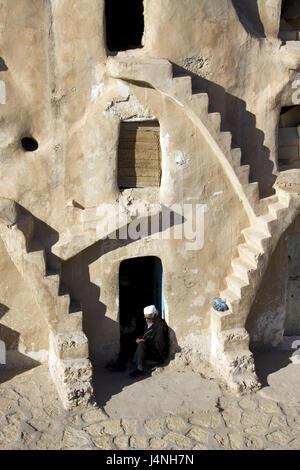 Tunisia, Medenine, memory castle, Ksar, man, North Africa, Berber's settlement, town, settlement, structure, facade, stairs, steps, Ksour, Ghorfas, defensive walls, place of interest, person, local, shade, sit, Stock Photo